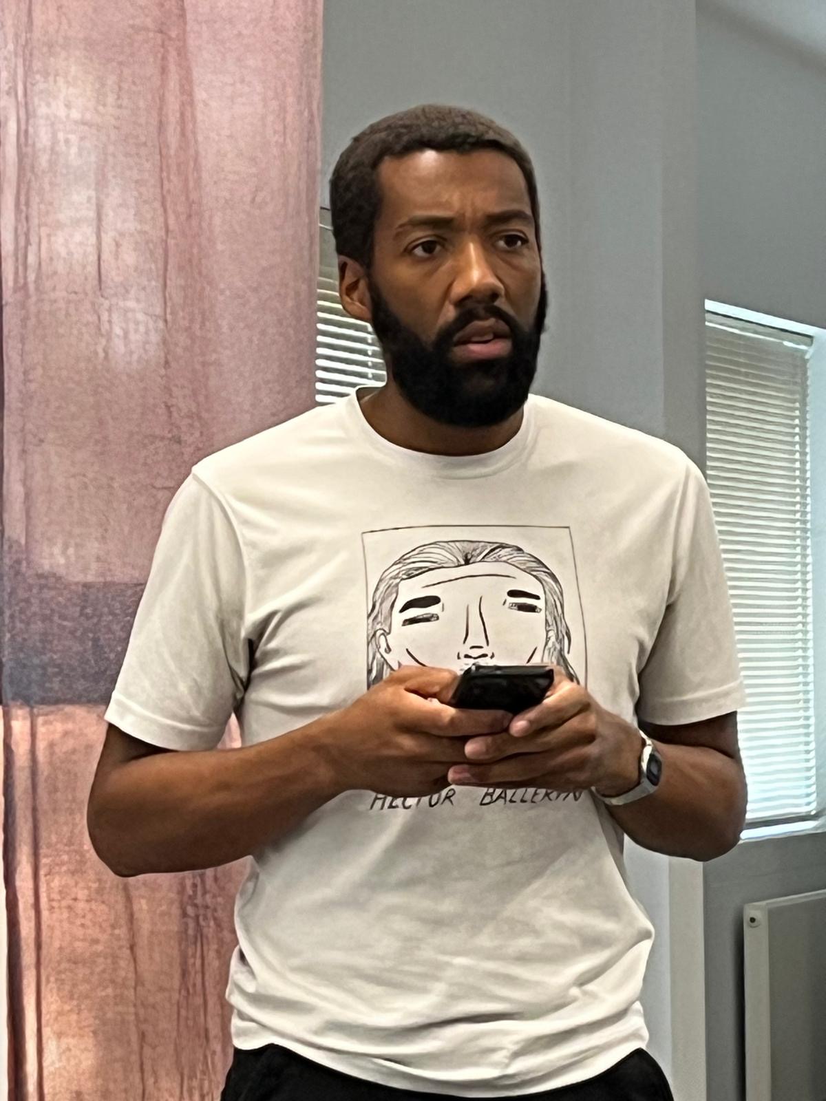 Actor reading a message on his phone in a Secret Love scene