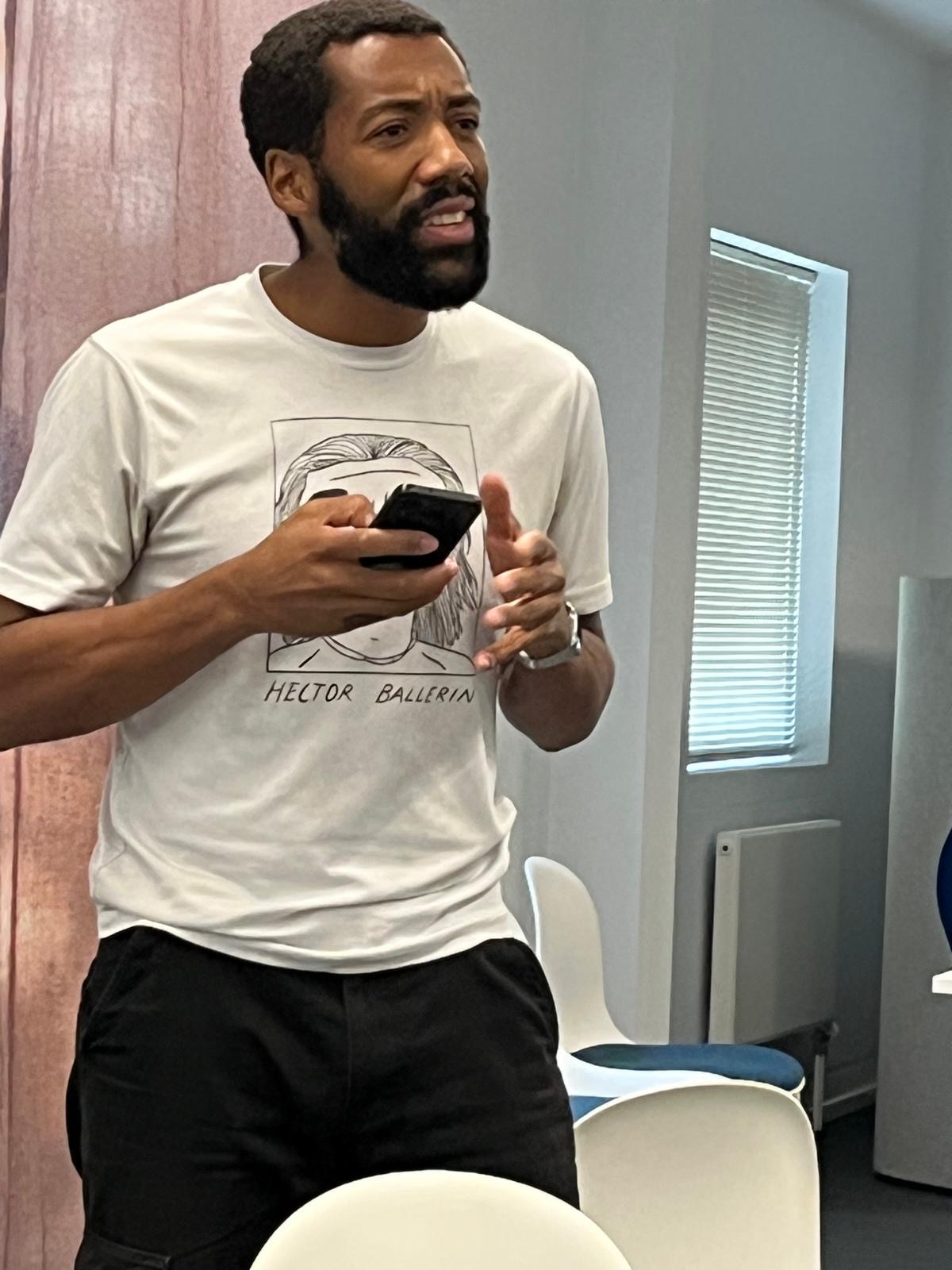 Actor reacting to a message on his phone during Secret Love